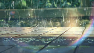Enjoy The Beauty Of Nature In This Thrilling Scene Of A Rainy Anime Day Wallpaper