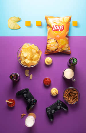 Enjoy The Crunchy Delight Of Potato Chips While Gaming Wallpaper