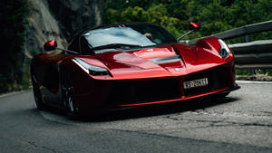 Enjoy The Luxury Of Driving A Ferrari Wallpaper