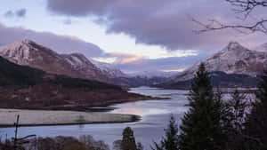 Enjoy The Majestic Beauty Of Mountain Scenery Wallpaper