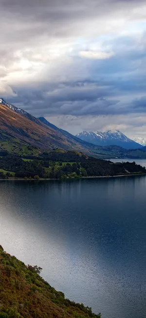 Enjoy The Peaceful Beauty Of Nature In One Of The Most Beautiful Mountain Lakes In The World. Wallpaper