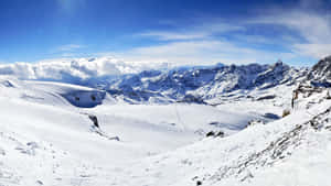 Enjoy The Powdery Snow And Majestic Views Of Ski Mountain! Wallpaper