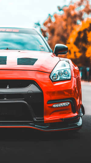 Enjoy The Power Of Speed With The Gtr Iphone. Wallpaper