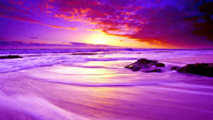 Enjoy The Shades Of Sunset On A Warm Beach Wallpaper