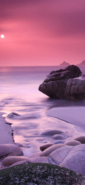 Enjoy The Shimmering Blues And Pinks Of A Peaceful Evening Wallpaper