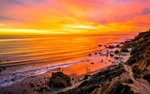 Enjoy The Sunrise At Malibu Beach Wallpaper