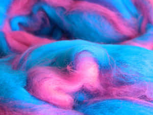 Enjoy The Sweet Treat Of A Fluffy, Pink Cotton Candy Swirl. Wallpaper