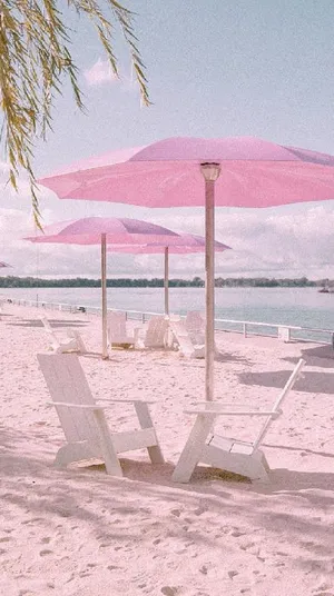 Enjoy The Sweetness Of Summer With A Pink Sunset Wallpaper