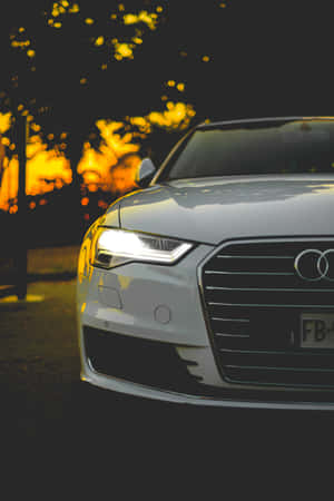 Enjoy Unparalleled Performance With Audi And The Latest Iphone. Wallpaper