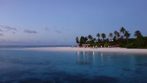 Enjoying A Beautiful Sunset On The Beach Wallpaper