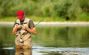 Enjoying An Afternoon Of Bass Fishing In The Lake Wallpaper