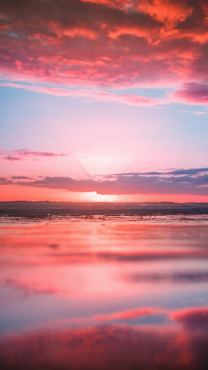 Enjoying The Colorful Sunset With My Pink Iphone Wallpaper