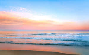 Enjoying The Serenity Of A Picturesque Pastel Beach. Wallpaper