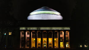 Enlightened Knowledge - The Great Dome Of Mit Under Starry Night Wallpaper