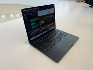 Enter A World Of Creativity With The Sleek Black Macbook Wallpaper