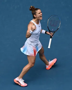 Enthusiastic Maria Sakkari Celebrating Victory On Court Wallpaper
