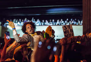 Eric Andre Crowd Surfing Performance Wallpaper