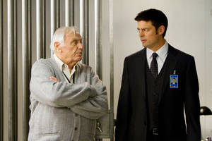 Ernest Borgnine And Karl Urban In Red Wallpaper