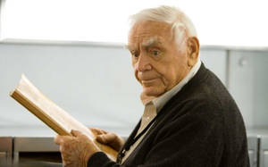 Ernest Borgnine Holding A Book Wallpaper
