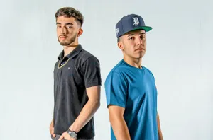 Eslabon Armado Performing Live On Stage Wallpaper