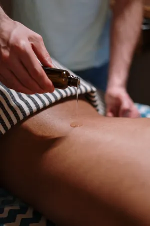 Essential Oil Therapy On Lower Back Wallpaper