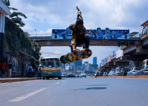 Ethiopia Man Skateboard On Road Wallpaper