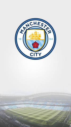 Etihad Stadium With The Manchester City Logo Wallpaper