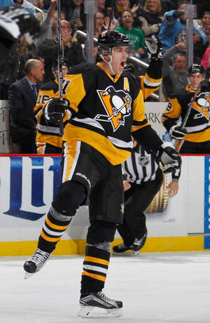 Evgeni Malkin Celebrating A Goal On Ice Wallpaper