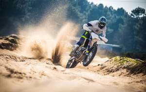 Exciting Motocross Racing In Action Wallpaper