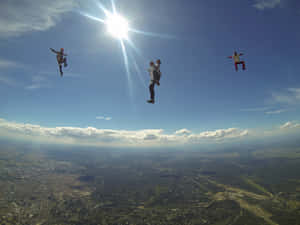 Exhilarating Freefall - Skydiving Adventure Wallpaper