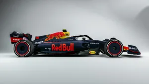 Exhilarating Speed - Red Bull F1 In Action Wallpaper