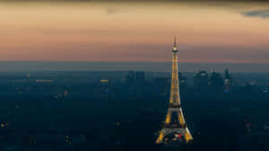 Experience The Cityscape Of Paris At Nightfall Wallpaper