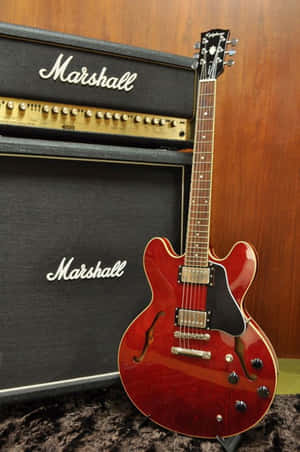 Experience The Sound Of A Vintage Gibson 335 Electric Guitar Wallpaper