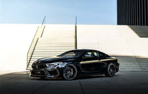 Experience The Thrill Of Driving A Bmw M8 Wallpaper