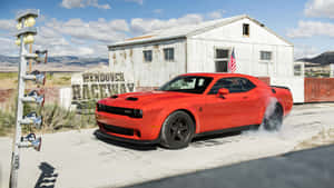 Experience The Thrill Of Driving The Dodge Challenger Wallpaper