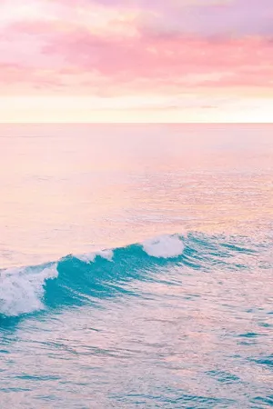 Explore The Beauty Of A Peaceful Pastel Beach Wallpaper
