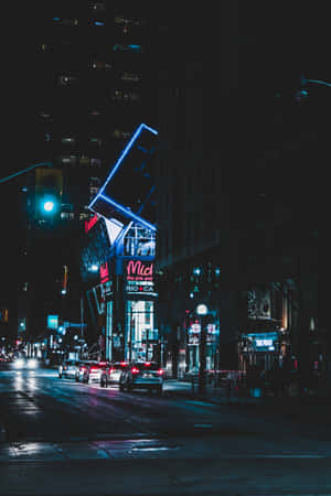 Explore The Bright Lights And Energy Of A Neon-lit City. Wallpaper