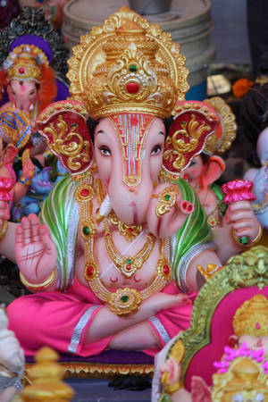 Exquisite Ganesh Statuette On A Mobile Device Wallpaper