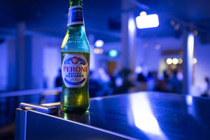 Exquisite Peroni Beer In Blue Ambiance Wallpaper