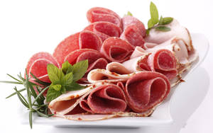 Exquisite Platter Of Salami And Ham Wallpaper