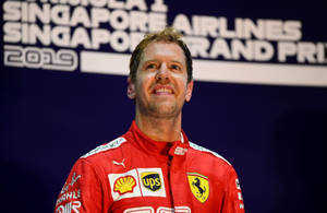F1 Champion Sebastian Vettel Gazing Up Wallpaper