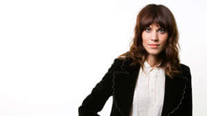 Fashion Icon Alexa Chung Posing In A Stylish Outfit. Wallpaper