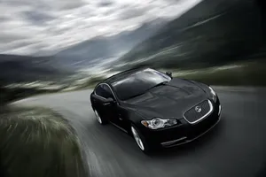 Fast-driving Black Jaguar Car Wallpaper