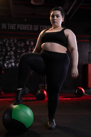 Fat Girl In A Black Gym Attire Wallpaper