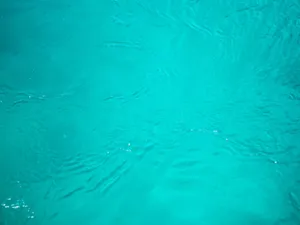 Feel The Calming And Tranquil Serenity Of Cyan Aesthetic Wallpaper