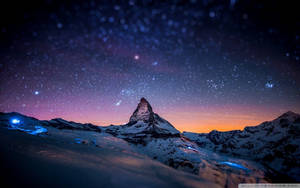 Feel The Majesty Of Nature At Night On A Mountain Wallpaper