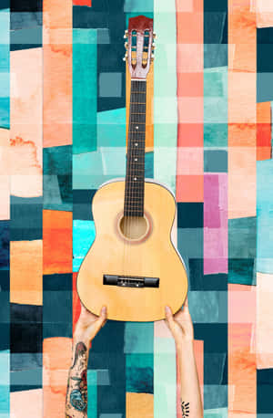 Feel The Music With This Vibrant Electric Guitar Wallpaper