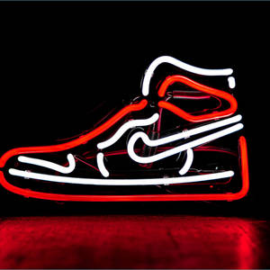 Feel The Power With The Cool Nike Shoe Wallpaper