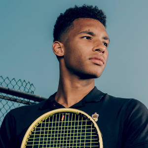 Felix Auger-aliassime In Thoughtful Contemplation Wallpaper