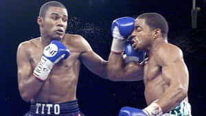Felix Trinidad Striking The Opposing Player Wallpaper